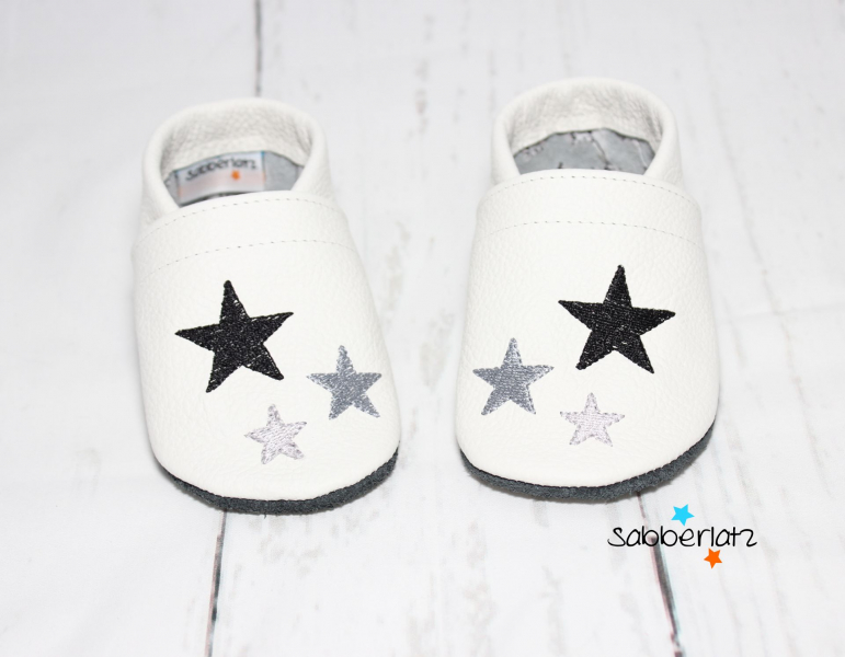 Lederpuschen mit Sternen