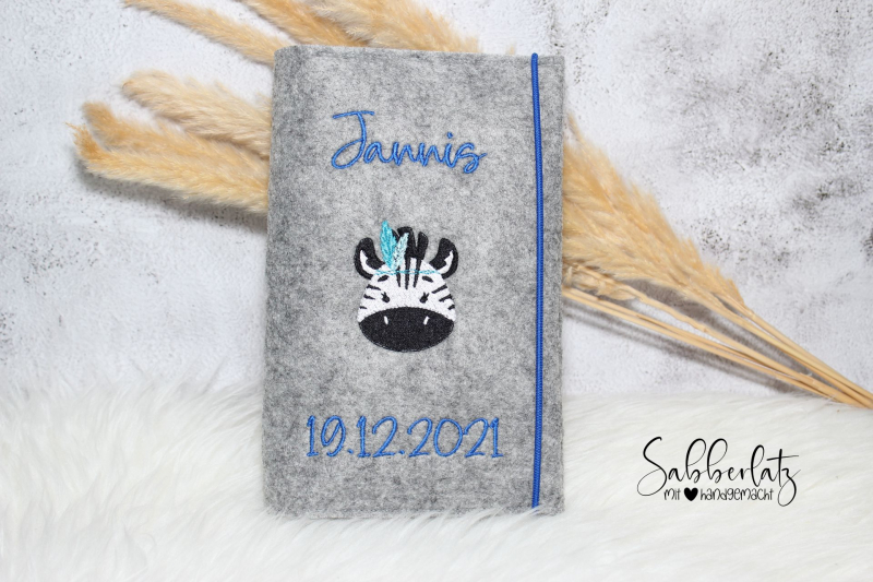 U-Heft-Hülle Zebra mit Federn