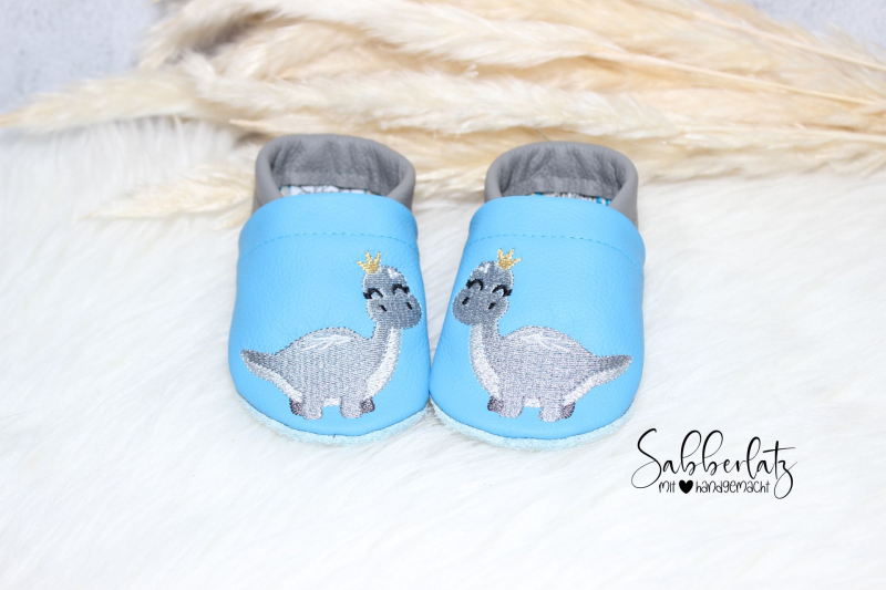 Dino mit Krone-Puschen